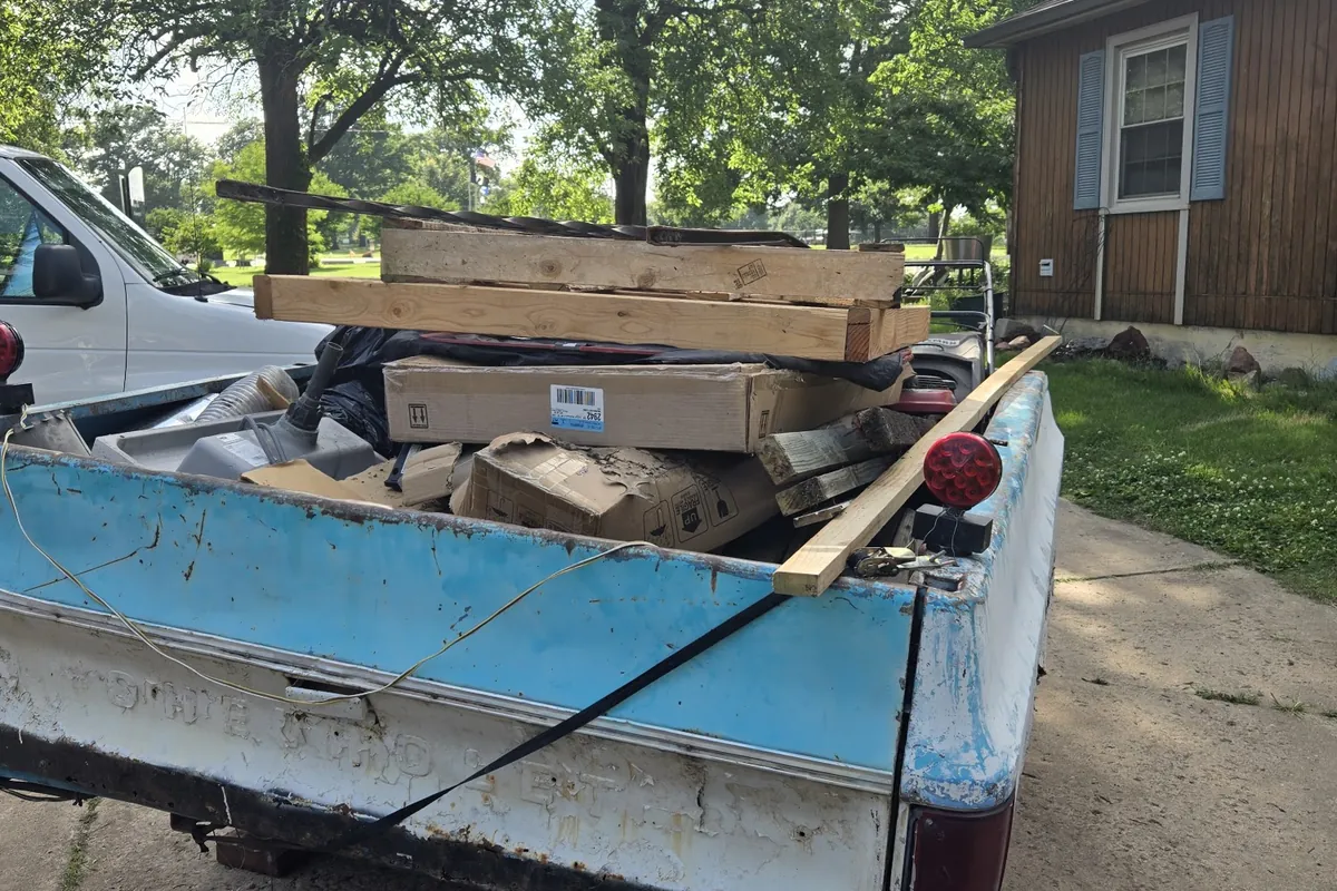Truck bed loaded with household junk headed for disposal