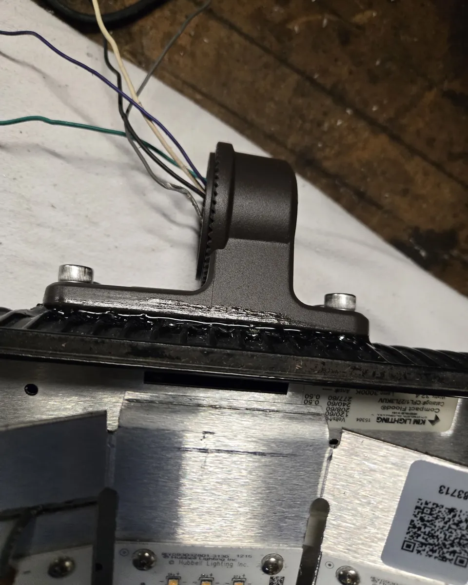 Metal mounting bracket on a light fixture