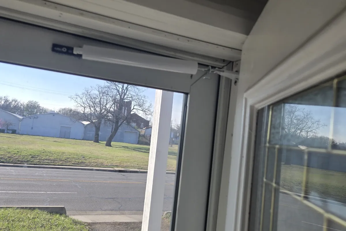 Storm door with closer installed, viewed from inside