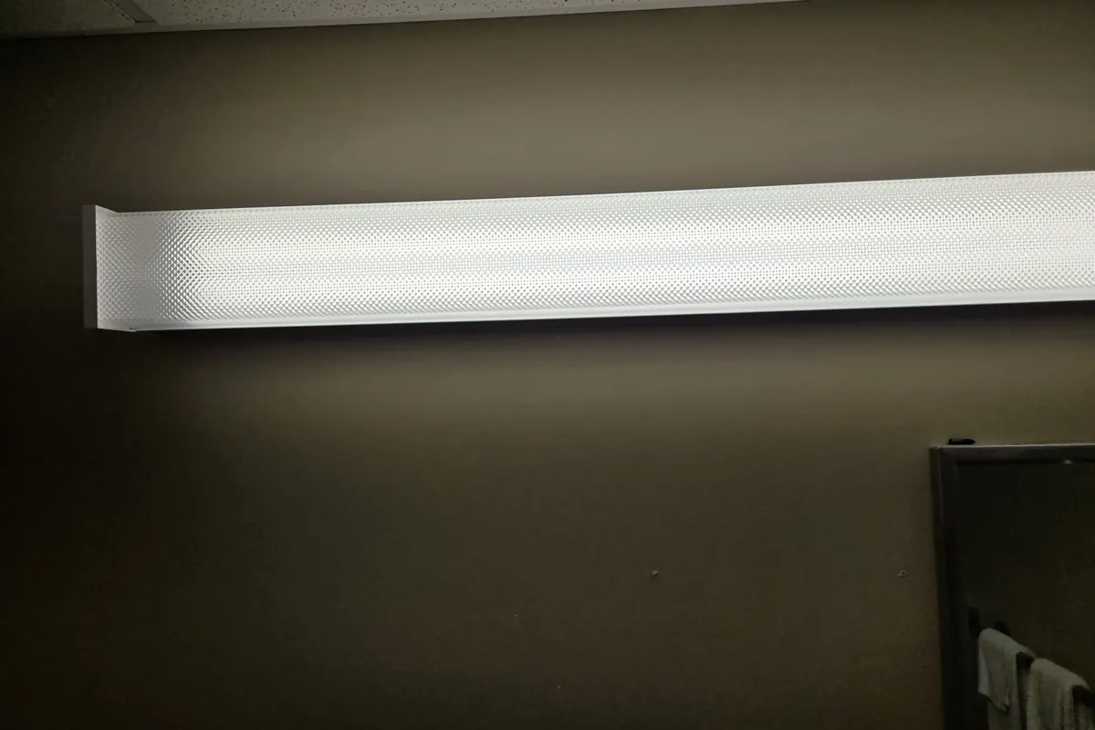 New LED light fixture installed on a wall