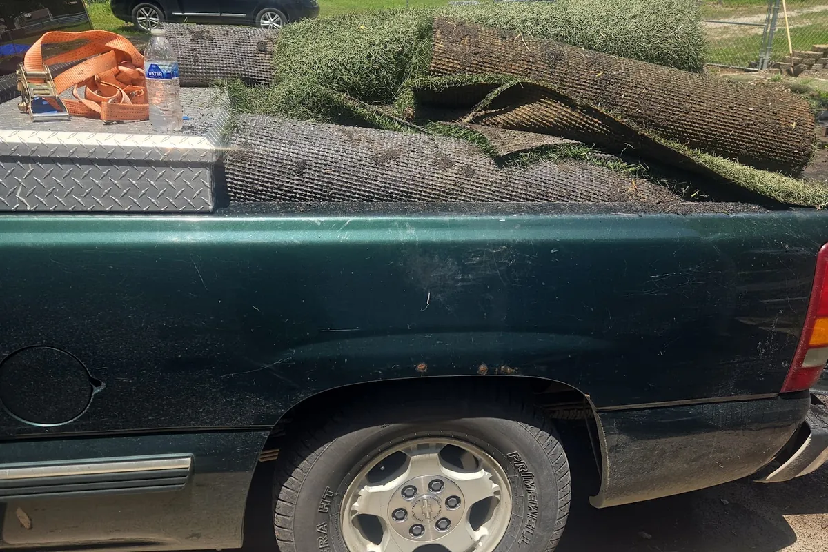 Pickup truck loaded with old sod and yard debris for disposal