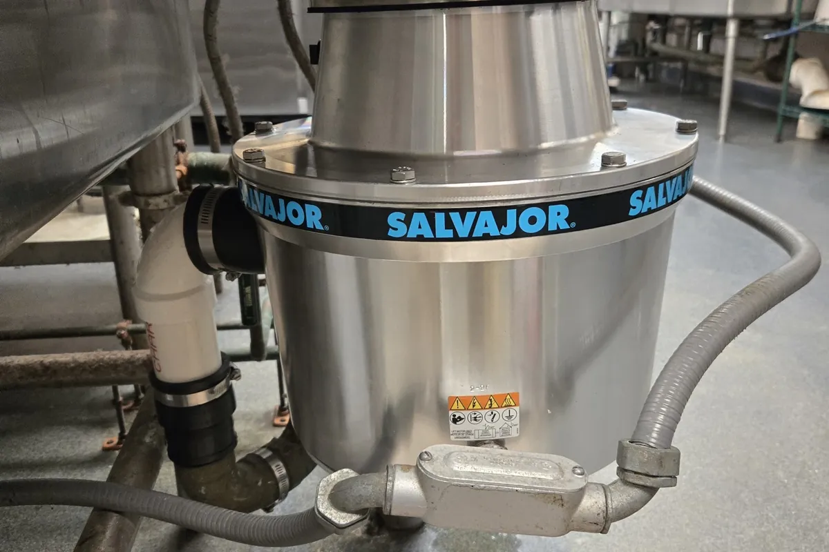 New commercial disposer installed under a kitchen sink