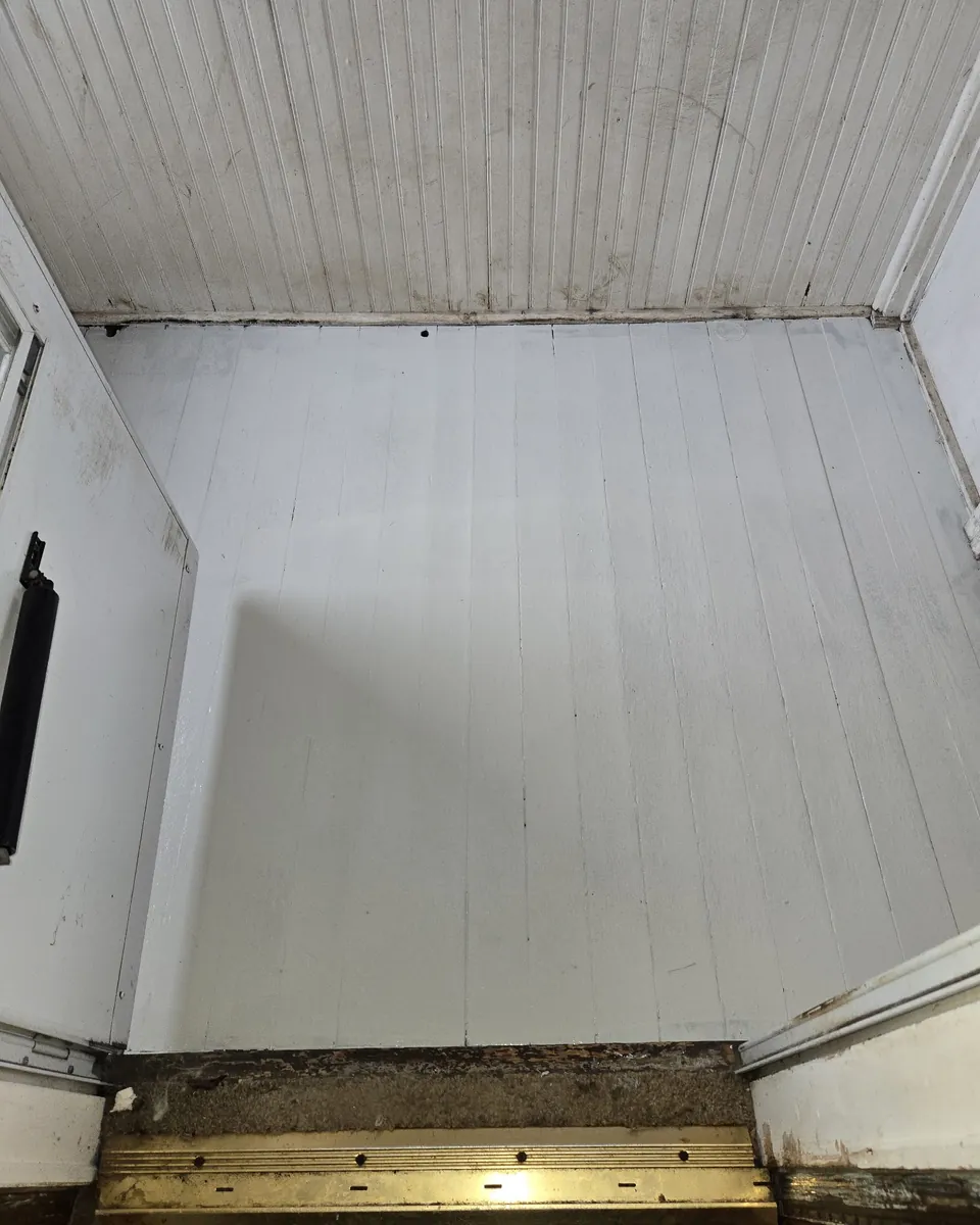 Empty, swept storage room after a clean-out