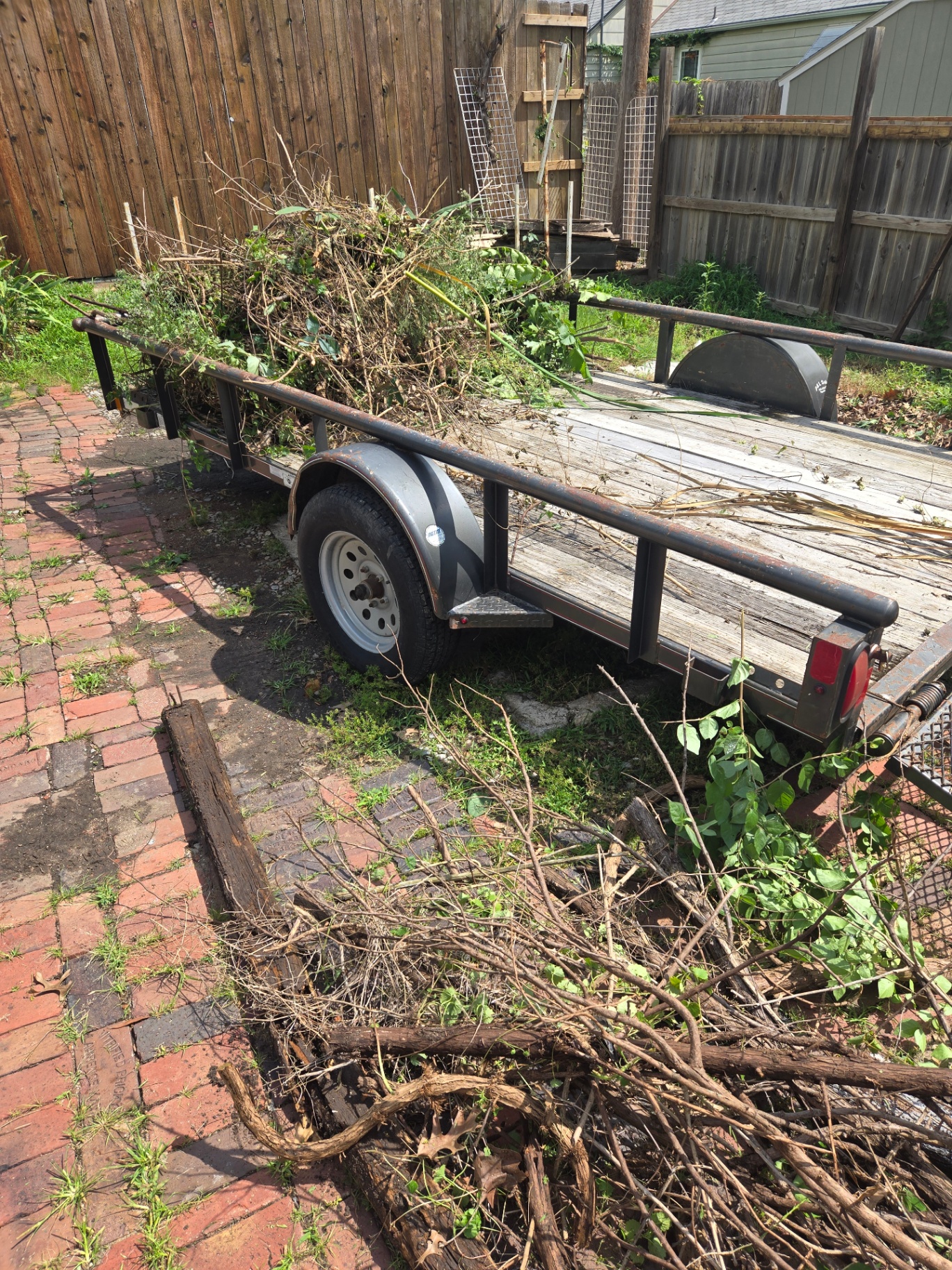 Trailer loaded with yard debris and brush from a Topeka clean out